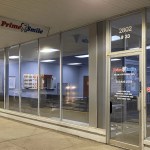 Storefront entrance of Prime Smile suite 33 located at 2802 Lafayette Road, displaying glass windows and operating hours